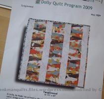 The other piece of good mail karma was the May Material Obsession dolly quilt kit  Tanglewood  see some dolly quilt action here    Yea for great mail  Ooh  speaking of which  I need to get Amanda s fabrics in the mail   Yipe  I don t know  it feels like I ve been spending far too much time this week doing things other