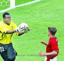 with Denmark England forward Michael Owen s attempt to score is thwarted by Nigerian goalkeeper Vincent Enyeama in the 2002 World Cup Group F match