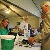 What is this  photo by Jason Schoonover Harlin Elseth  right  looks at a photo album with his granddaughter Jennifer Elseth at an open house at Green Lea