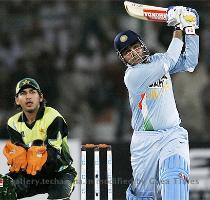 Virendra Sehwag plays a shot for six during a Asia Cup Group B match between India and Pakistan at The National Cricket Stadium in Karachi on June 26  2008  Sehwag smashed a 95 ball 119 and