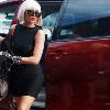 the LIFE Candid Lady Gaga is a true fashion icon    decked out in vintage sunglasses and leather fingerless gloves in Perth  Australia  On another note   is Lady Gaga using a mini van as her means of