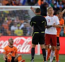 <p>Netherlands  Wesley Sneijder  left  contests French referee Stephane Lannoy s decision as Denmark s Simon Kjaer  second from right  walks on during the World Cup group E soccer match between the Netherlands and Denmark at Soccer City in Johannesburg  South Africa  Monday  June 14  2010  < p>