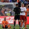 <p>Netherlands  Wesley Sneijder  left  contests French referee Stephane Lannoy s decision as Denmark s Simon Kjaer  second from right  walks on during the World Cup group E soccer match between the Netherlands and Denmark at Soccer City in Johannesburg  South Africa  Monday  June 14  2010  < p>