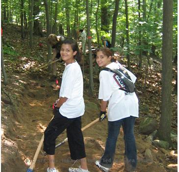 Delilah Perez and Rachael Rodriguez take a break from hard bench cutting work