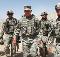 Gen  David H  Petraeus  center  near Baghdad in July  Whether to fight on is a  big  big decision  a national decision   he says  Johan Spanner for The New York Times From The Wall Street