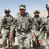 Gen  David H  Petraeus  center  near Baghdad in July  Whether to fight on is a  big  big decision  a national decision   he says  Johan Spanner for The New York Times From The Wall Street