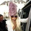 Lady Gaga has added a few pound of hair to her normally crazy do  I just keep thinking  what if it fell  what then  She was on her way to perform in Copenhagen  Denmark