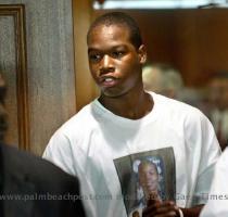 Wearing a T shirt with a picture of Jerrod Miller  his twin brother Sherrod walks out of the courtroom during a break at the inquest into the death of the 16 year old Monday morning  Miller