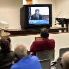 Spectators in an overflow courtroom watch the proceedings in the inquest into the death of 16 year old Jerrod Miller Monday morning  Three televisions were set up in the room that can seat 125