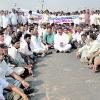 Photo  G N  Rao ON THE WARPATH  Pourasamiti members squatting near the Godavari bridge in Bhadrachalam on Monday