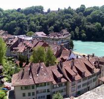 appear to have remained sacred in Switzerland  so none of the shops had opened  The human traffic was minimal  let alone the near non existent vehicle traffic on the old Bern streets  We walked down to the chalky turquoise and fast flowing river  then back up to Bern s cathedral  which offers gorgeous views over the old town and even across to the Alpine mountains in the