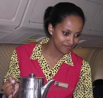 So my story is biased and subjective  showing the best of Eritrea  as I would like to remember it and show it to the rest of the world  Woyane  if you don t like it  don t read it  Flight attendant Helen serving coffee on the flight to Asmara