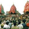 Jagannath  Subhadra  Balbhadra are decorated in procession  very big three chariots are there with ropes and the huge then the chariots are pulled by millions millions of devotees in orissa