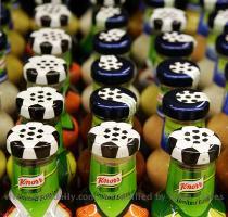 Different barbecue sauces in bottles designed with soccer jerseys are pictured in a supermarket in Olching  near Munich May 24  2006  Only 15 companies were awarded the right to market