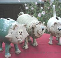 Cat money banks are made in lots of different styles and colours  We can even make them without the slot if you prefer