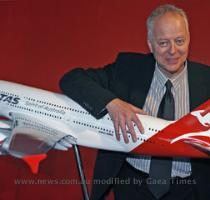 TICKETS please     designer Hans Hulsbosch displays his streamlined kangaroo logo on a model of a Qantas Airbus A380 Super Jumbo which is due to begin international commercial flights