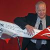 TICKETS please     designer Hans Hulsbosch displays his streamlined kangaroo logo on a model of a Qantas Airbus A380 Super Jumbo which is due to begin international commercial flights
