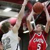 Canton s Paul Baumgart lifts a shot over the outstretched arm of Plymouth s Brennen Beyer Friday night   photo courtesy of PlymouthPictures com