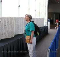 Eventful and then on to see Howard speak  05 25 PM   This is a really great photograph of a conference goer checking out a hand written list of all of the US soldiers that have died since the start of the conflict in Iraq  It is just