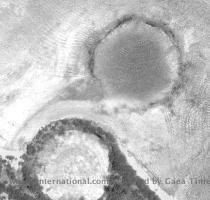 May 25 2009 Nuclear explosion craters  Eniwetok Atoll  Marshall Islands  South Pacific  The crater on the left has been filled with radioactive waste and covered with concrete  Both craters are about a