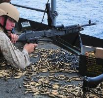 Lance Cpl  Michael Rogers used it all  PACIFIC OCEAN  May 22  2009  Lance Cpl  Michael Rogers awaits instruction after firing an M 240B machine gun during a live fire exercise aboard the aircraft carrier USS George Washington  CVN