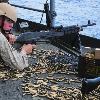 Lance Cpl  Michael Rogers used it all  PACIFIC OCEAN  May 22  2009  Lance Cpl  Michael Rogers awaits instruction after firing an M 240B machine gun during a live fire exercise aboard the aircraft carrier USS George Washington  CVN