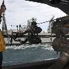 PACIFIC OCEAN  July 18  2009    Boatswain s Mate 2nd Class Travell Young gives orders to the capstan operator aboard USS George Washington  CVN 73  during a replenishment at sea with USNS