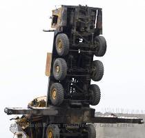 Reuters Pictures 2 months ago Delhi Metro Rail Corporation  DMRC  workers sit on a tractor in front of an overturned crane