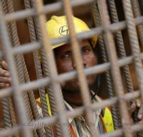 Reuters Pictures 3 months ago A Delhi Metro Rail Corporation employee looks through iron rods at the final tunnelling