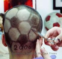 Presumably both before and after getting this haircut this World Cup fan was kicked in the head  Posted in