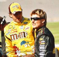 support of our troops  as he waits for the start of the  Great American Race    Front Row Joe  leans on his backup Army Chevrolet  after a crash on Thursday eliminated his first choice   Young Guns  Elliott Sadler  left  and Jamie McMurray  right  talk strategy on pit row