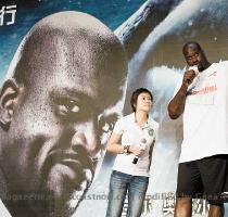 How is Shaquille O Neal   shown earlier this month during a promotional tour in Beijing  China   training to be a Cav  By challenging other stars in sports in a TV series that will debut