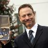 Getty Images 9 months ago Actor Gary Sinise shows his Presidential Citizens Medal outside the White House in Washington  DC after receiving the medal from US President