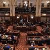 An overall shot of the Illinois Senate chambers as Thomas Fitzgerald  Chief Justice of the Illinois Supreme Court   center  presides over the start of Illinois Governor Rod Blagojevich s