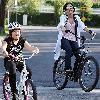 Camp Rock  star Demi Lovato takes advantage of the spring sunshine on a bike ride with her  Desperate Housewives  sister  Madison De La Garza