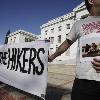 Photo   Supporters of three hikers held in Iran  protest in front of Sproul Hall at University of California  Berkeley in Berkeley  Calif   Wednesday  Sept  30  2009  Photo   Shane