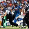 Daniel Vettori of New Zealand runs Zaheer Khan of India out during the fifth one day international match between the New Zealand Black Caps and India at Eden Park on March 14  2009 in Auckland