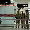 Next   Getty Images 7 months ago Members of the Indian paramilitary personnel stand guard at a departure gate of the Indira