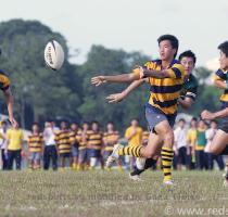down   but not before passing the ball to Stuart Ho  no 13  who finished the play with a try  The conversion was not made  however  and at the end of the first half  RJC were leading 5 3  Shane Gan of ACS I  makes a pass to a teammate before he gets tackled  � Leslie Tan Red Sports Barely two minutes into the second half  ACS I  twisted the situation around when they
