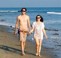 Alicia Silverstone and her husband  rocker Christopher Jarecki  enjoy a romantic stroll in Malibu  His tat  Says  I would for you