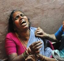 <p>A woman cries on January 10  after a bus accident involving pilgrims to the Sabarimala Shrine in the south western Indian state of Kerala  At least 64 people died and scores were injured Friday in a stampede at a religious festival in southern India triggered by a vehicle crashing into a crowd  officials said < p>